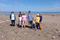 A picture of the Rockwatcher’s on the beach of Skipsea Withow Mere.